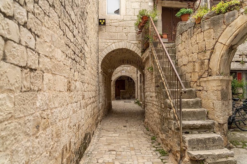 Narrow alley in the old town centre of Trogir, Croatia, Europe