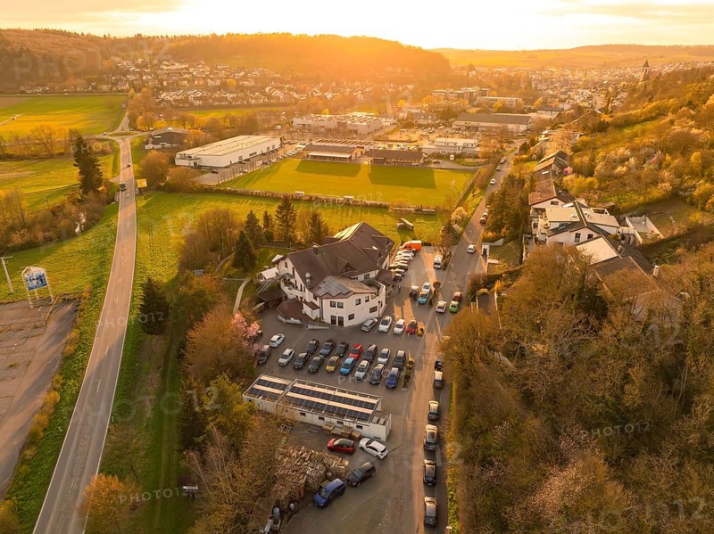 Urban landscape with an accentuated sunset over the fields and buildings, Europäischer Hof, Königsbach, Germany, Europe