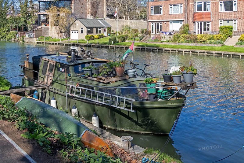 Old boat lying on the bank, River Cam, Cambridge, England, Great Britain