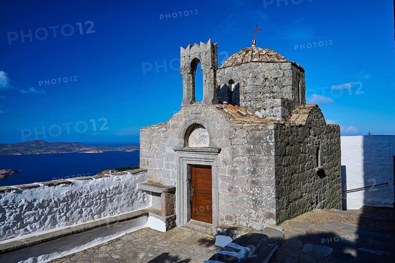 Historic chapel on a hill overlooking the sea under a clear sky, Agiou Theologou Monastery, St John's Monastery, Chora, Patmos, Dodecanese, Greek Islands, Greece, Europe