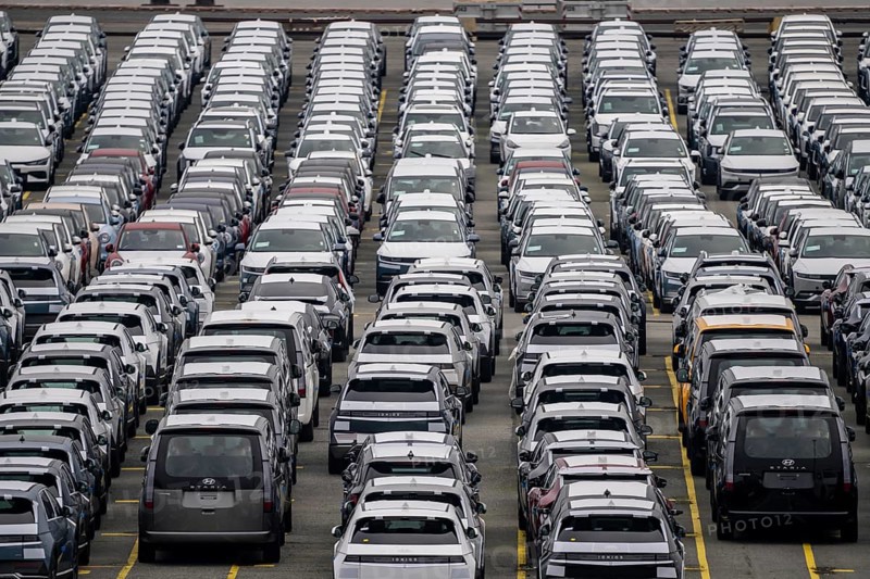 Parking space for import vehicles, hundreds of Hyundai Ioniq, electric cars, waiting for onward transport, at the EUROGATE container terminal in the overseas harbour of Bremerhaven, Lower Saxony, Germany, Europe