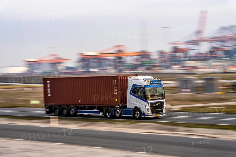 Container lorry, bringing containers from Euromax Container Terminal, the seaport of Rotterdam, Netherlands, deep-sea port Maasvlakte 2, on an artificial land area off the original coastline