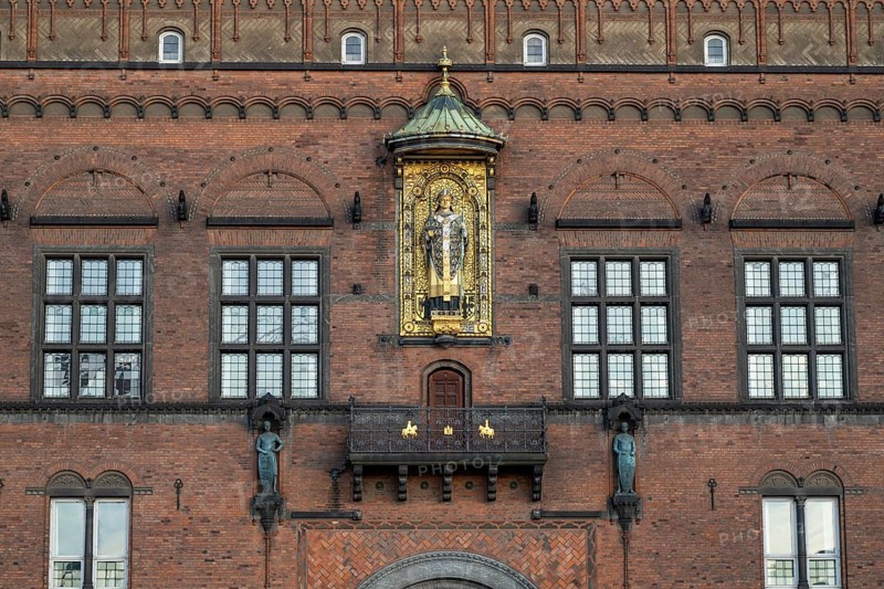 Brick façade with gilded sculpture of Bishop Absalon, Town Hall in the National Romantic style by Martin Nyrop, Town Hall Square, Rathausplatz or Rådhuspladsen, Copenhagen, Denmark, Europe