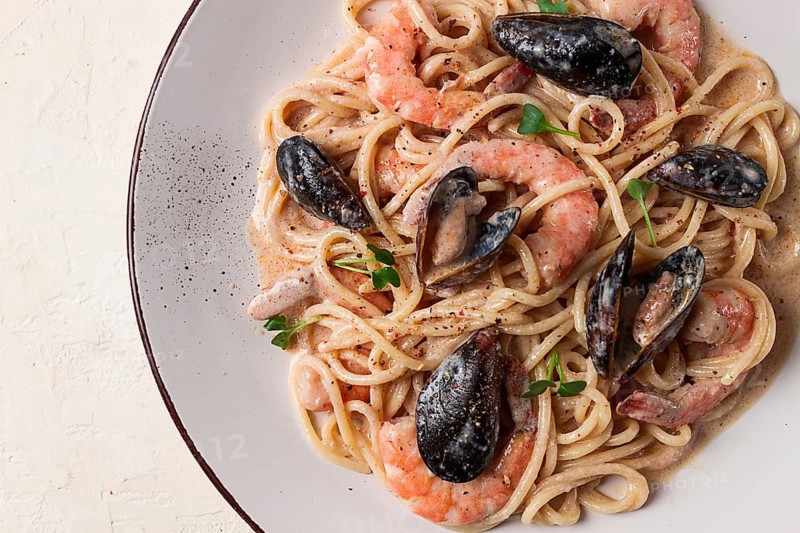 Spaghetti, pasta, with seafood, shrimp with mussels, in creamy garlic sauce, homemade, no people