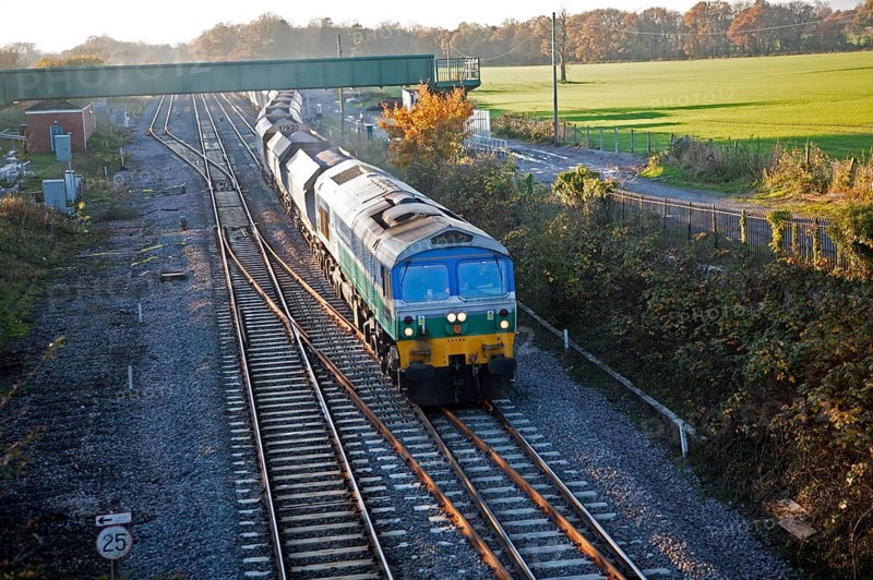 Diesel locomotive freight train on the West Coast mainline at Woodborough, Wiltshire, England, UK