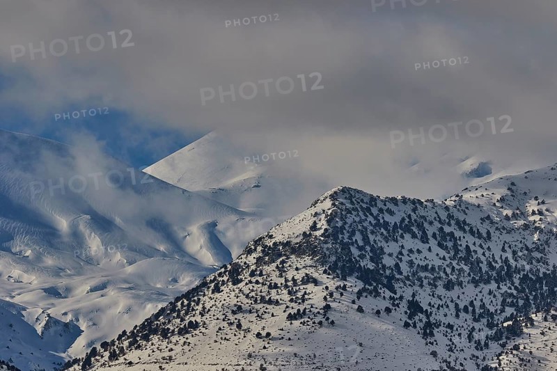 Snow-covered mountain range under a cloudy sky, Lefka Ori, White Mountains, mountain massif, west, Crete, Greece, Europe