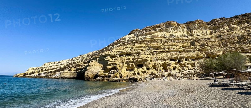 View of sandstone rocks Partial view of former Roman necropolis with sandstone caves carved into sandstone Cave tombs Grottoes in rocks on the north side of Matala Bay, in the 60s and 70s hippie caves Caves for dropouts and hippies today excursion destination on the south coast of the island of Crete, left at the edge of the picture Libyan Sea Mediterranean, Matala, Crete, Greece, Europe