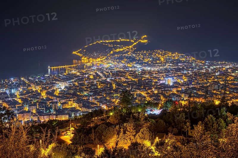 The lights of the city of Alanya on the Turkish Riviera glow in the evening, Alanya, Antalya, Turkey, Asia