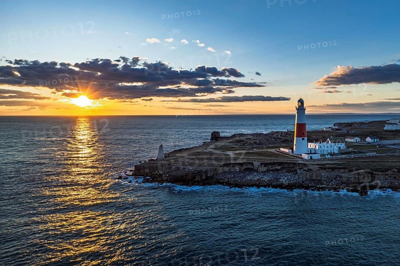 Sunset over Portland Bill Lighthouse from a drone, Portland Bill, Isle of Portland, Dorset, England, United Kingdom, Europe