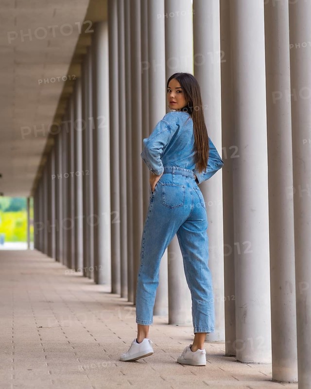 Young caucasian girl with a monkey cowboy next to a white columns. Enjoying the city on vacation, lifestyle of a young girl in a fashionable poster