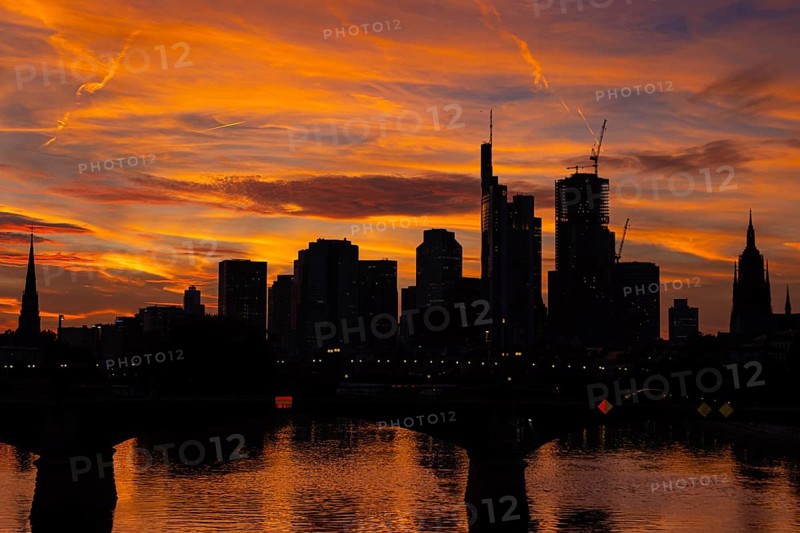 The silhouette of Frankfurt's banking skyline stands out against the luminous evening sky in the evening after sunset., Frankfurt am Main, Hesse, Germany, Europe
