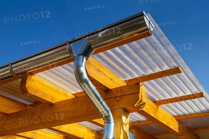 New patio roofing with wood and corrugated acrylic glass panels