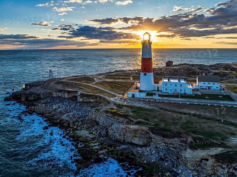 Sunset over Portland Bill Lighthouse from a drone, Portland Bill, Isle of Portland, Dorset, England, United Kingdom, Europe