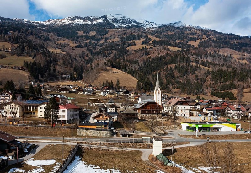 Drone shot, view of village with parish church, Rangersdorf, Mölltal, Carinthia, Austria, Europe