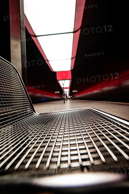 Modern underground station with metal bench and red lighting effects, Hafencity University, Hamburg, Germany, Europe