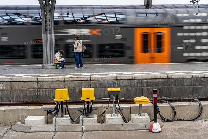Digitalisation at Deutsche Bahn, in the yellow cable protection and distribution boxes the data cables from various sensors, such as axle counters, signals, points, RFID recording devices, etc., converge on the tracks, from here they are sent to the digital interlocking technology to record data for controlling rail traffic, Cologne, North Rhine-Westphalia, Germany, Europe