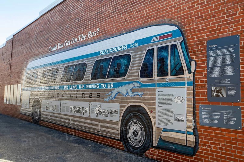 Anniston, Alabama - A mural of a Greyhound bus outside the Freedom Riders National Monument. In the early 1960s, integrated groups of riders rode Greyhound and Trailways buses through the South to challenge racial segregation in interstate transportation. The riders were beaten, and arrested. In Anniston, a bus was burned