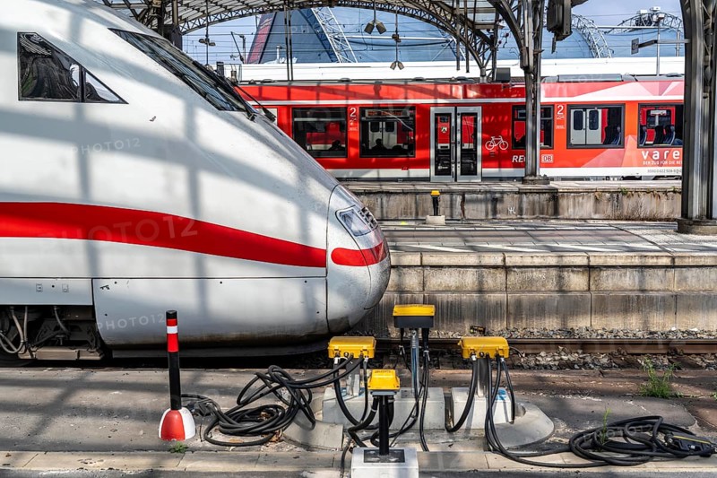 Digitalisation at Deutsche Bahn, in the yellow cable protection and distribution boxes the data cables from various sensors, such as axle counters, signals, points, RFID recording devices, etc., converge on the tracks, from here they are sent to the digital interlocking technology to record data for controlling rail traffic, Cologne, North Rhine-Westphalia, Germany, Europe