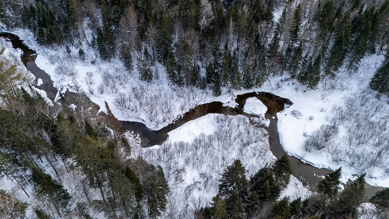 River in the boreal forest in winter. Region of La Mauricie. Province of Quebec. Canada