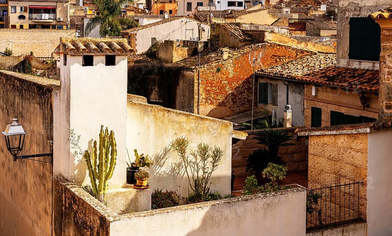 View of Mediterranean houses, roofs and courtyards from the town wall, Alcudia, Majorca, Spain, Europe