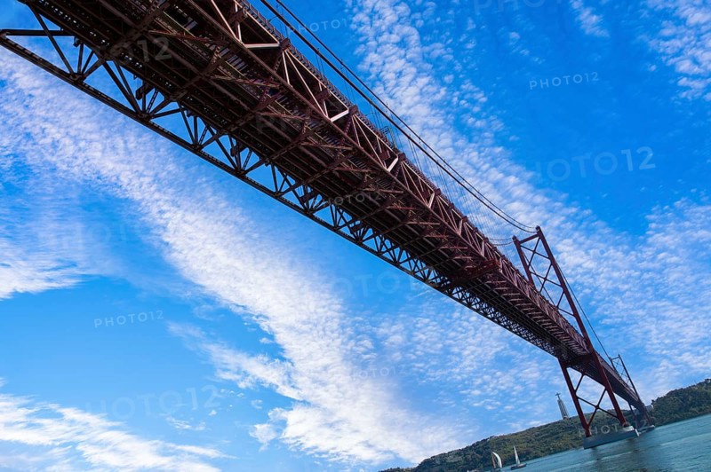 Lisbon, Landmark suspension 25 of April bridge over Tagus reiver near Belem tower