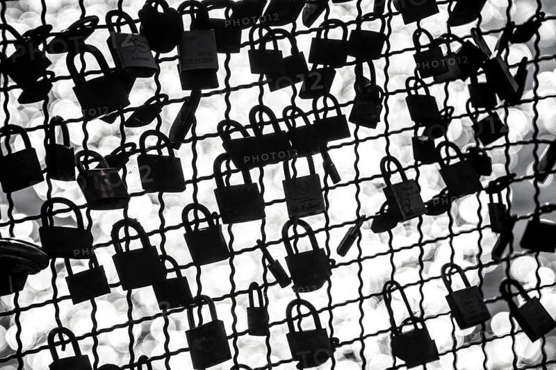Padlocks, so-called love locks on a fence, vantage point in Wesel am Rhein, North Rhine-Westphalia, Germany, Europe