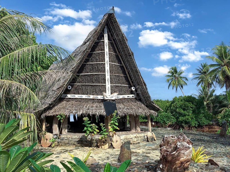 Traditional historical meeting house for men Tribal Chief Men Men's House between palm trees, in the background Pacific Ocean, Yap Island, Yap State, Caroline Islands, FSM, Federated States of Micronesia, Australia, Oceania