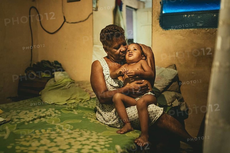 Lucilla Iriarte (68) with her grandson Alaín (2) in Petare, Caracas, Venezuela, South America