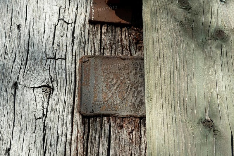 An old rusty hidden tin sign on a half-timbered barn, Wildeshauser Geest, Bassum, Diepholz, Lower Saxony, Germany, Europe