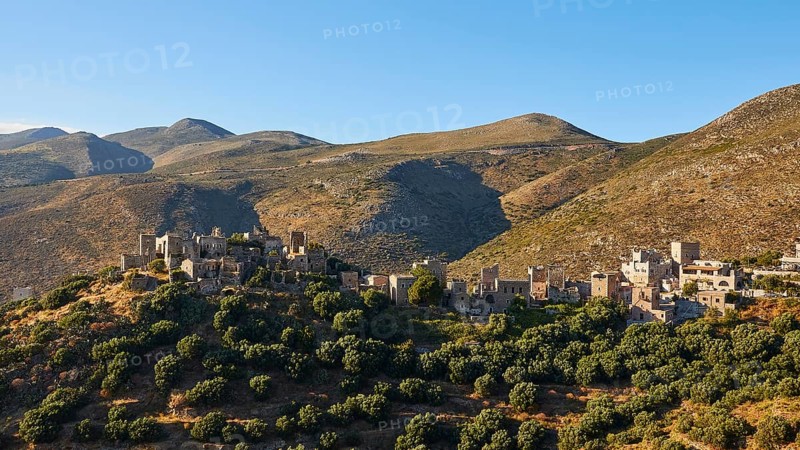 Historic village on sunlit hills, Vathia, residential tower village, Mani peninsula, Peloponnese, Greece, Europe