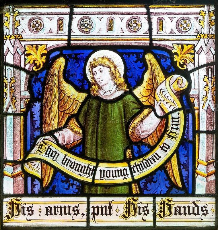 Detail of angel on stained glass window 'Suffer the Little Children' by Burlison & Grylls c 1880, Kelsale church, Suffolk, England, UK