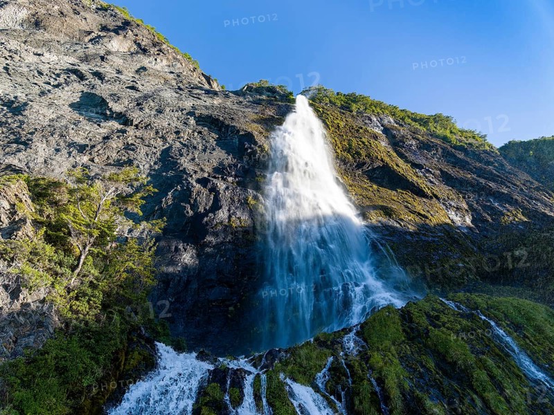 Waterfall at the Bay of Last Hope, fjords and mountains, Puerto Natales, Patagonia, Chile, South America