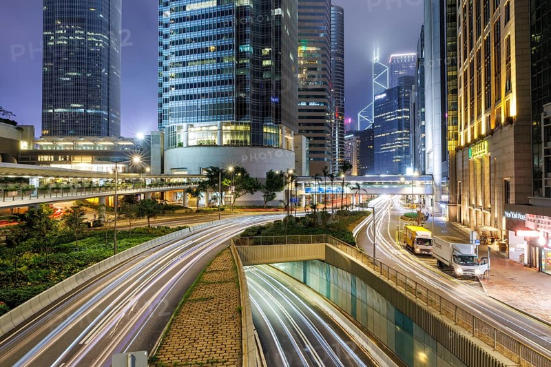 Traffic with streets and skyscrapers in the city of Hong Kong at night in Hong Kong, China, Asia