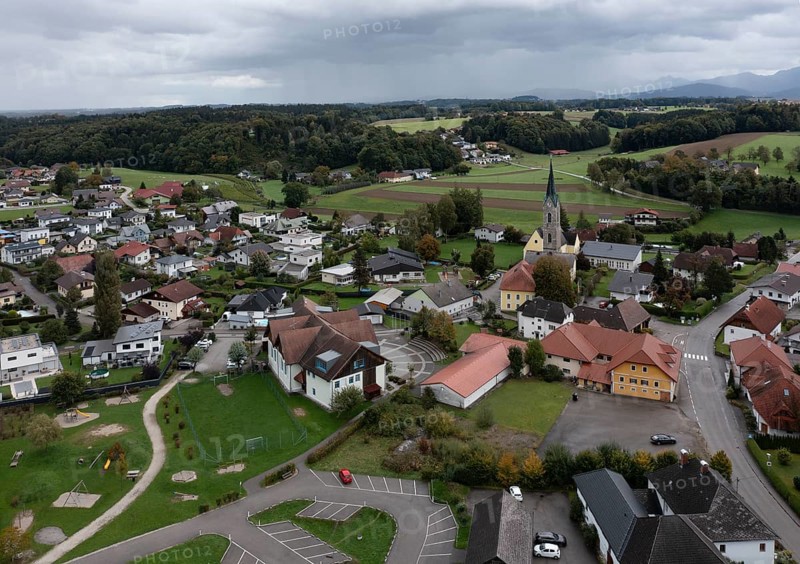 Drone shot, view of village with parish church, Rutzenmoos, Hausruckviertel, Upper Austria, Austria, Europe