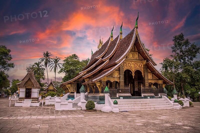 Lovely sunset at a lovely temple in Luang Prabang in summer, Laos, Asia