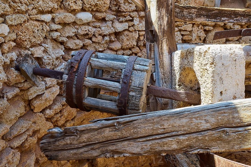 Close-up of a wooden cogwheel component in an old stone building ruin, windmill, ruin, near Lindos, Lindos, Rhodes, Dodecanese, Greek Islands, Greece, Europe