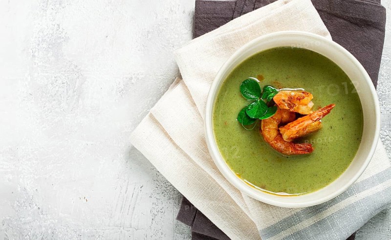 Pea cream soup, with shrimp, green soup, homemade, top view, no people