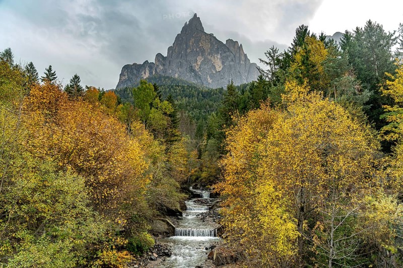 Autumn at the Schwarzgriesbach stream and the Schlern mountain in Seis am Schlern, South Tyrol, Italy, Europe