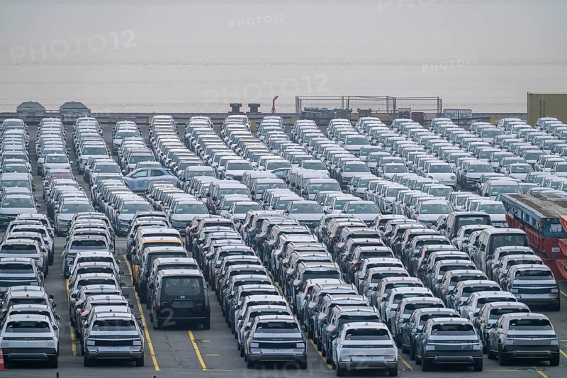 Parking space for import vehicles, hundreds of Hyundai Ioniq, electric cars, waiting for onward transport, at the EUROGATE container terminal in the overseas harbour of Bremerhaven, Lower Saxony, Germany, Europe
