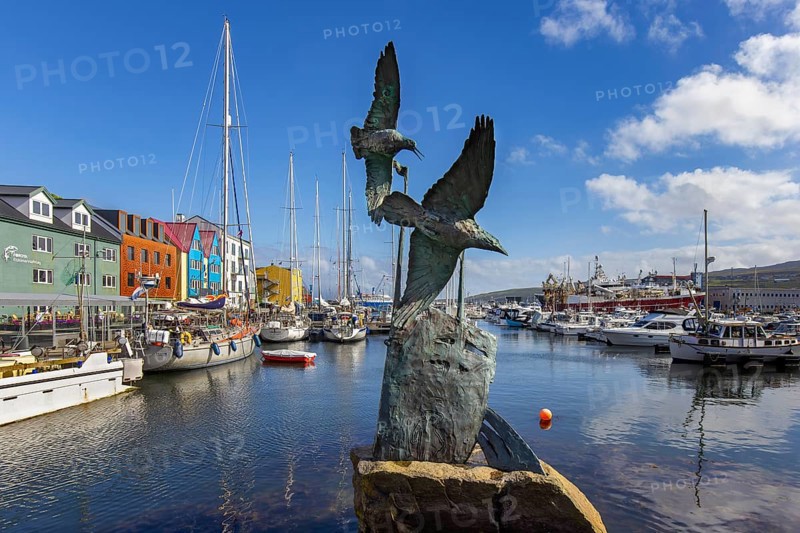 Battle of the Birds sculpture, tribute to Nólsoyar Páll, 18th century Faroese national hero in the harbour of Tórshavn, Thorshavn port, Faroe Islands, Europe