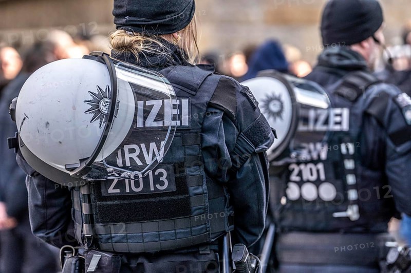 Police officers of a riot squad, riot police, with helmet and riot suit at a left-right demonstration in Essen, North Rhine-Westphalia, Germany, Europe