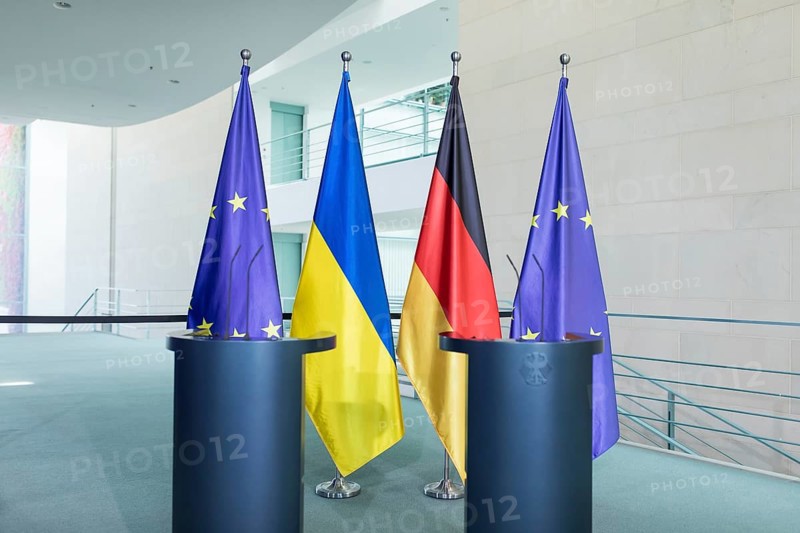 Flags of the European Union (EU), Ukraine and the Federal Republic of Germany in front of the joint press statement by Volodymyr Zelensky (President of Ukraine) and Olaf Scholz (Chancellor of the Federal Republic of Germany) at the Federal Chancellery, 11 October 2024