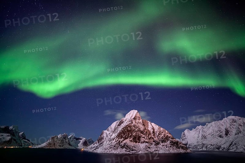 Green northern lights reflected in fjord, steep mountains, aurora borealis, winter, Reine, Moskenesoya, Lofoten, Norway, Europe