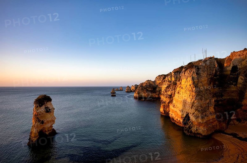 Colourful cliffs and rocks at sunrise on the beach, Praia da Dona Ana, Lagos, cliffs, Atlantic Ocean, Algarve, Portugal, Europe