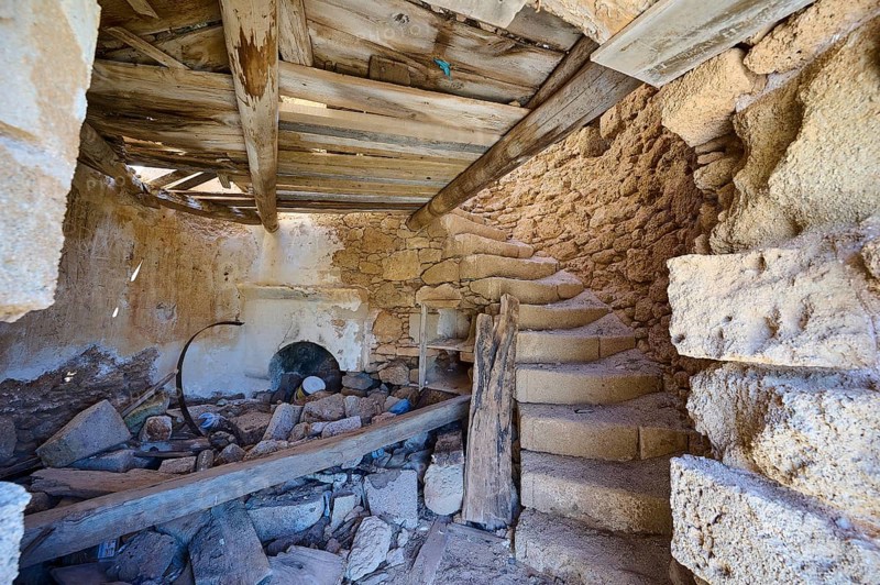 The interior of an old, abandoned mill with stone staircase and decaying wooden beams, windmill, ruin, near Lindos, Lindos, Rhodes, Dodecanese, Greek Islands, Greece, Europe