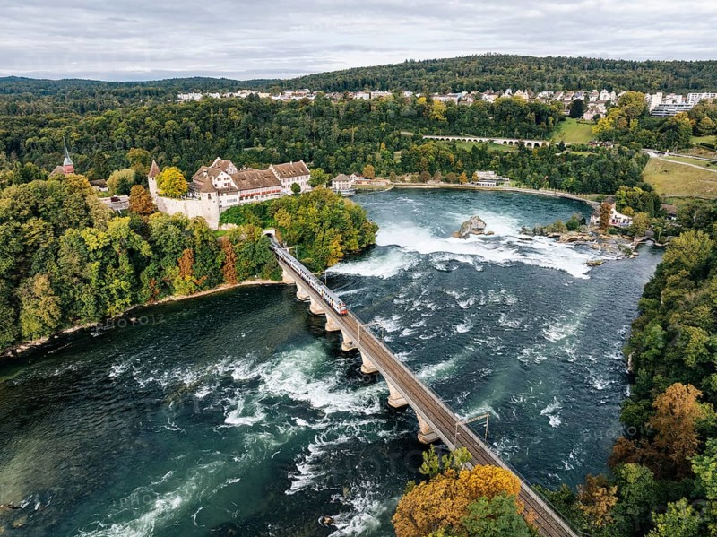 Aerial view of the Rhine Falls with railway viaduct and Laufen Castle in autumn, Neuhausen, Canton Schaffhausen, Switzerland, Europe
