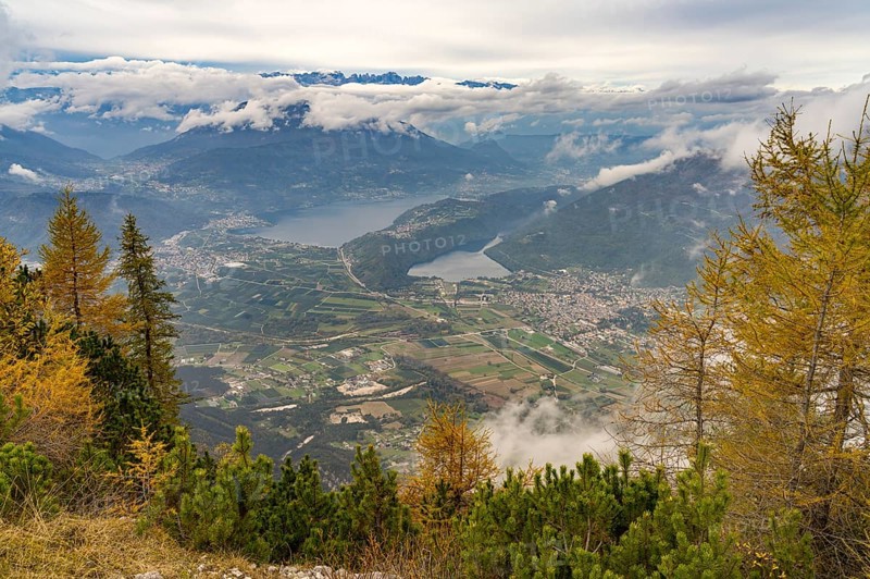 View from the summit of Mount Pizzo di Levico to the lakes in the Sugana Valley, Trentino, Italy, Europe