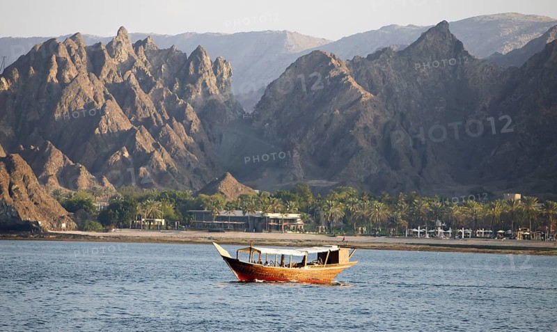 Dhow in the Gulf of Oman, behind the Hajar Mountains, boat trip along the coast of al Khayran, Muscat, Muscat Province, Oman, Asia