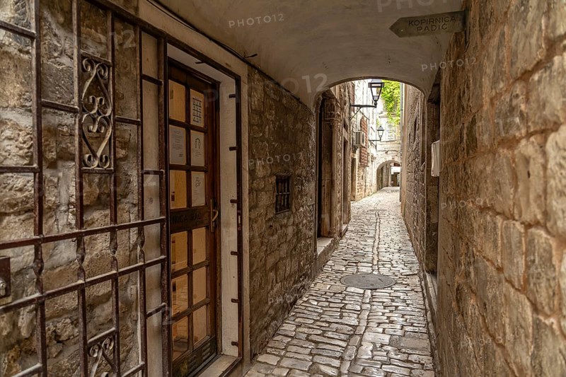 Narrow alley in the old town centre of Trogir, Croatia, Europe