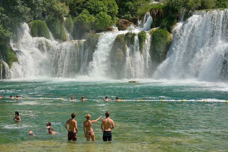 Tourists taking a bath at the Skradinski buk waterfalls, Krka National Park, Šibenik-Knin County, Dalmatia, Croatia, Europe